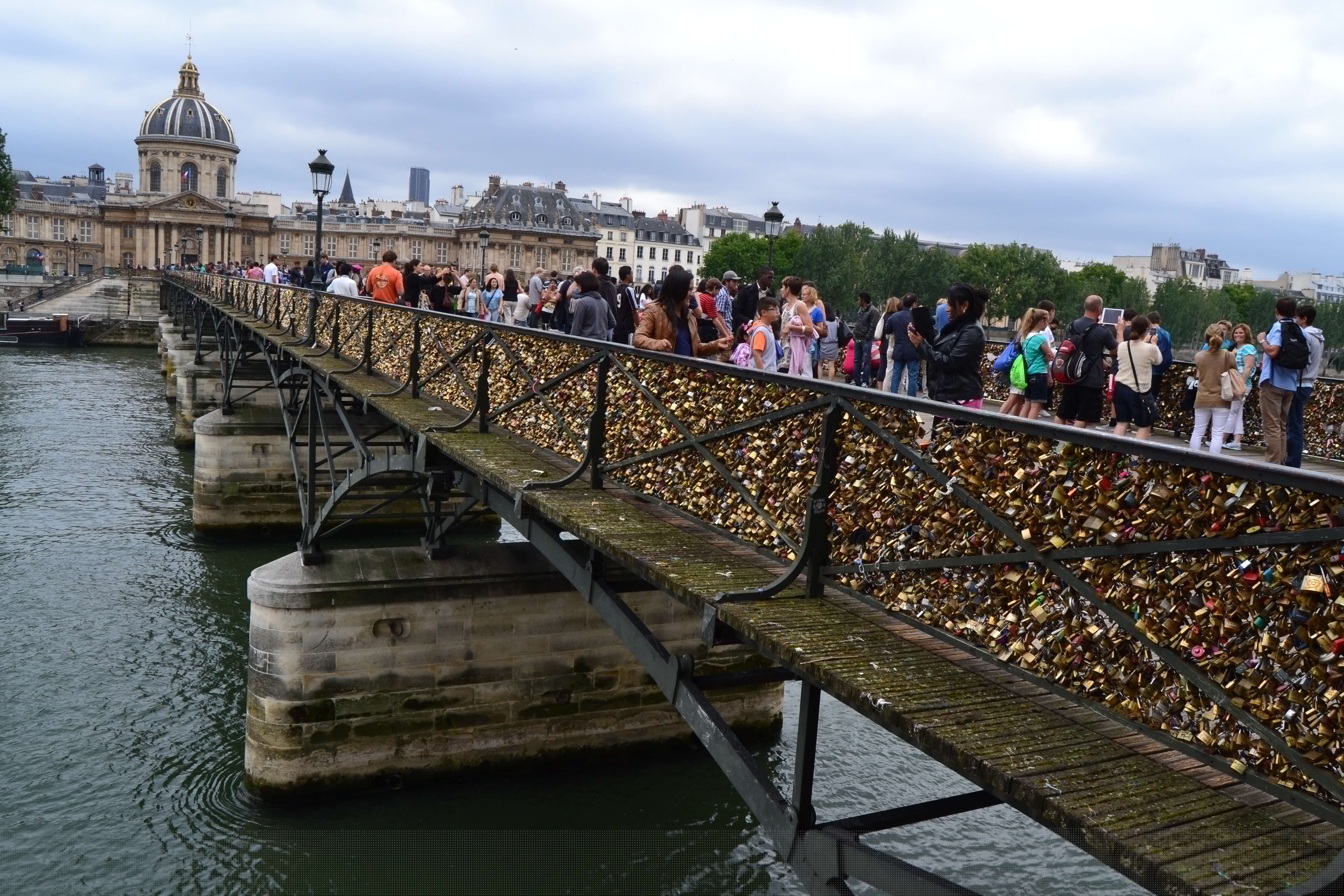 Historic view of Pont des Arts Love Lock Bridge Paris before collapse showing thousands of physical locks
